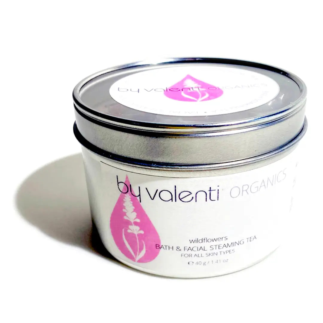 BY VALENTI tin of wildflowers bath & facial steaming tea on a white background